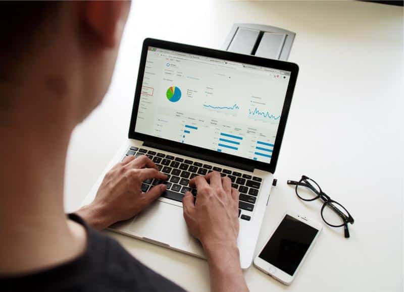 Marketing manager looking at Google Analytics for website analytics data
