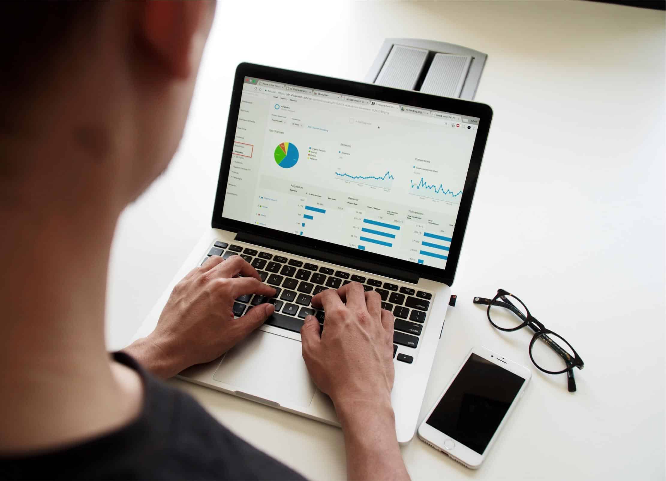 Marketing manager looking at Google Analytics for website analytics data